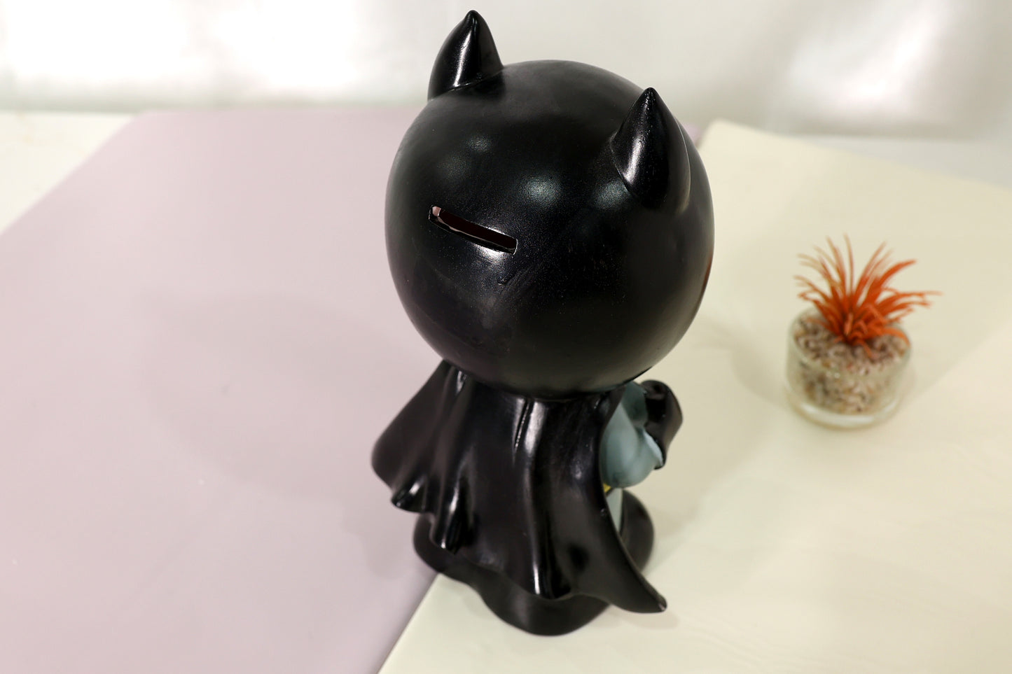 Superhero-Style Character Piggy Bank – Black Design