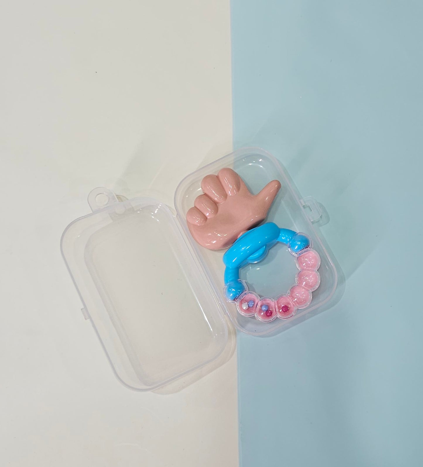 Engaging Thumb Teething Rattle.